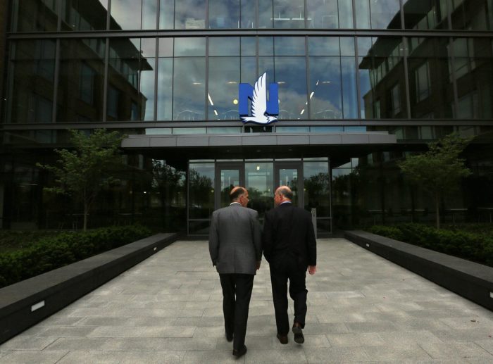 Brian Ellis and Mayor of Grandview Heights Ray DeGraw walk into the front entrance to the new Nationwide offices